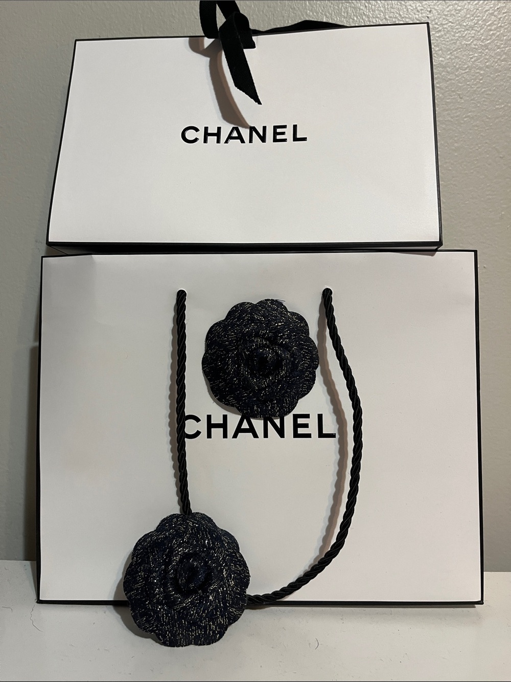 CHANEL White Shopping Bags with Black Camellia Rope Accents